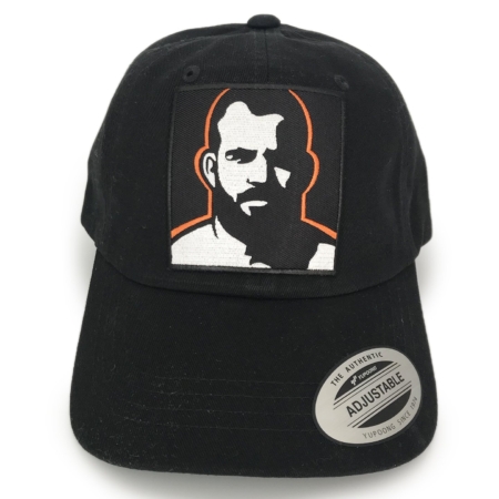 Embroidered Man Icon Patch Black Classic Dad Cap by Chris Lopez