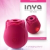 Inya The Rose Silicone Rechargeable Clitoral Stimulator Dark Pink on charging station with package